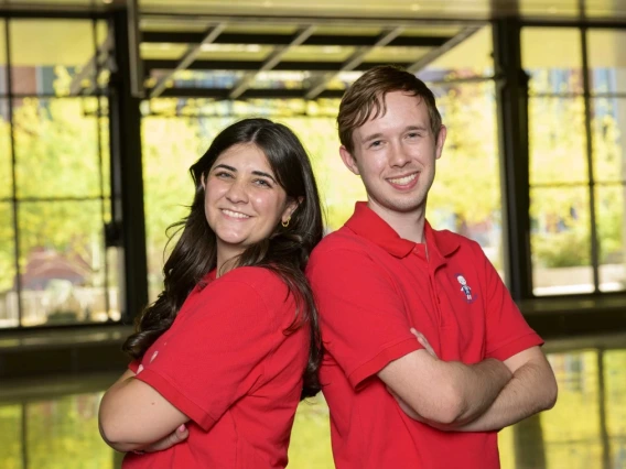 Lauren Taylor and Matthew Racine standing back to back.