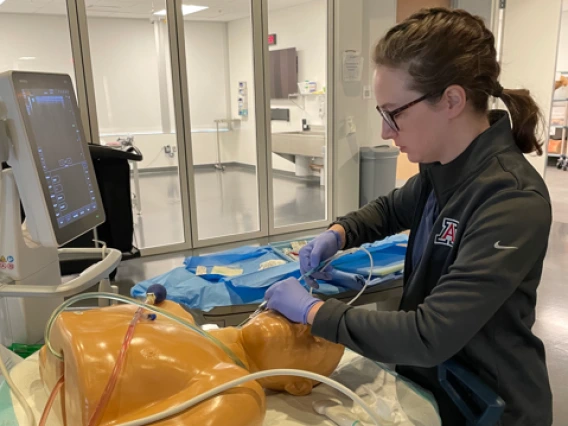 a DNP-NA resident practicing on a dummy