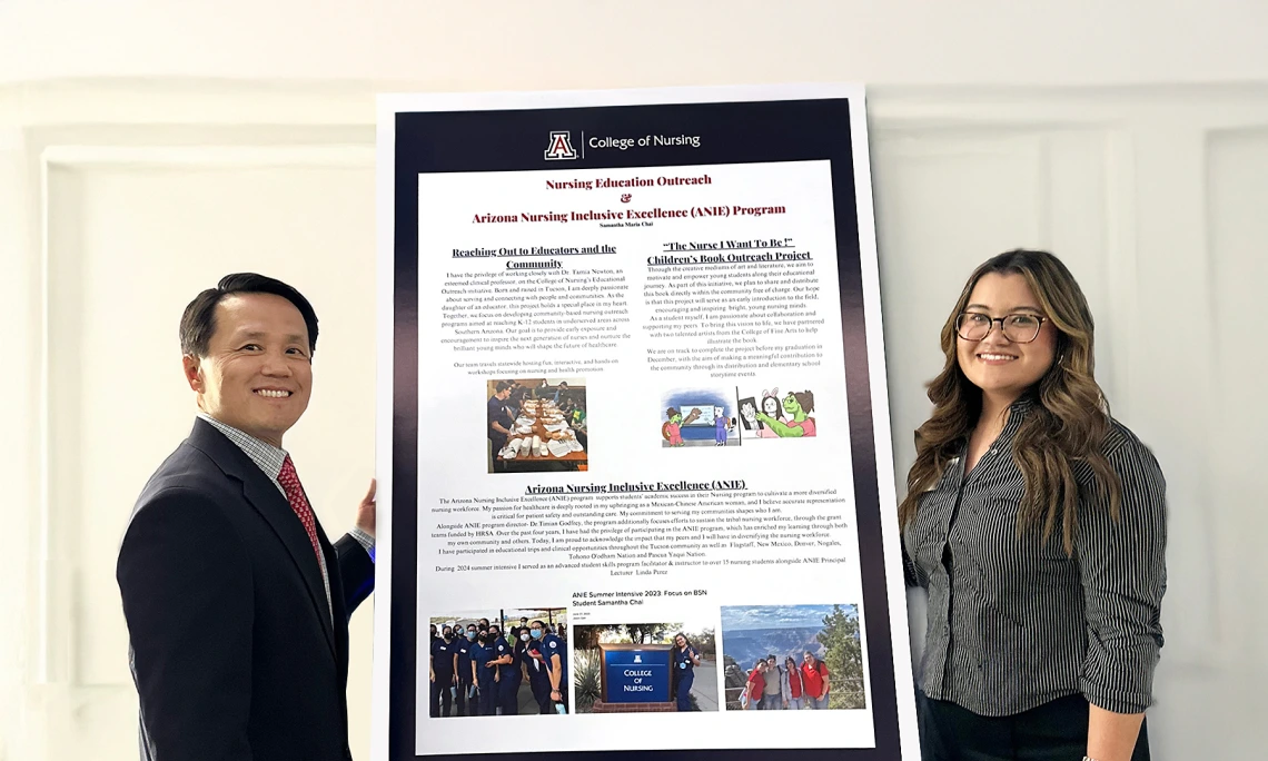 Dean and Samantha Chai standing around her presentation board.