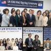 Four separate photos of each college's representatives when they signed the MOU.